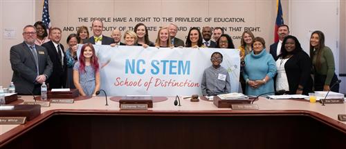 Eastern Elementary School accepting NC STEM School of Distinction Banner