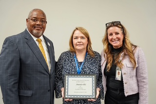 Woman receiving plaque