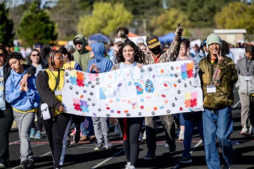 Group of students holding a banner.